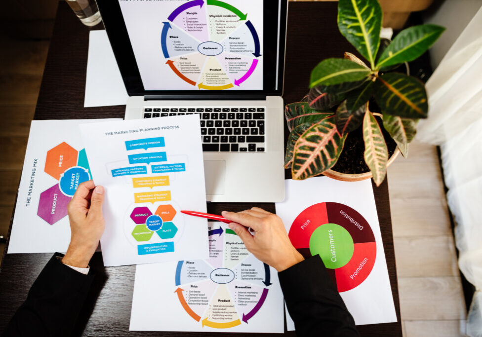 marketing research of new product. product marketing manager making marketing strategy for new product. Manager holding new product and developing new marketing strategy plan for customers.